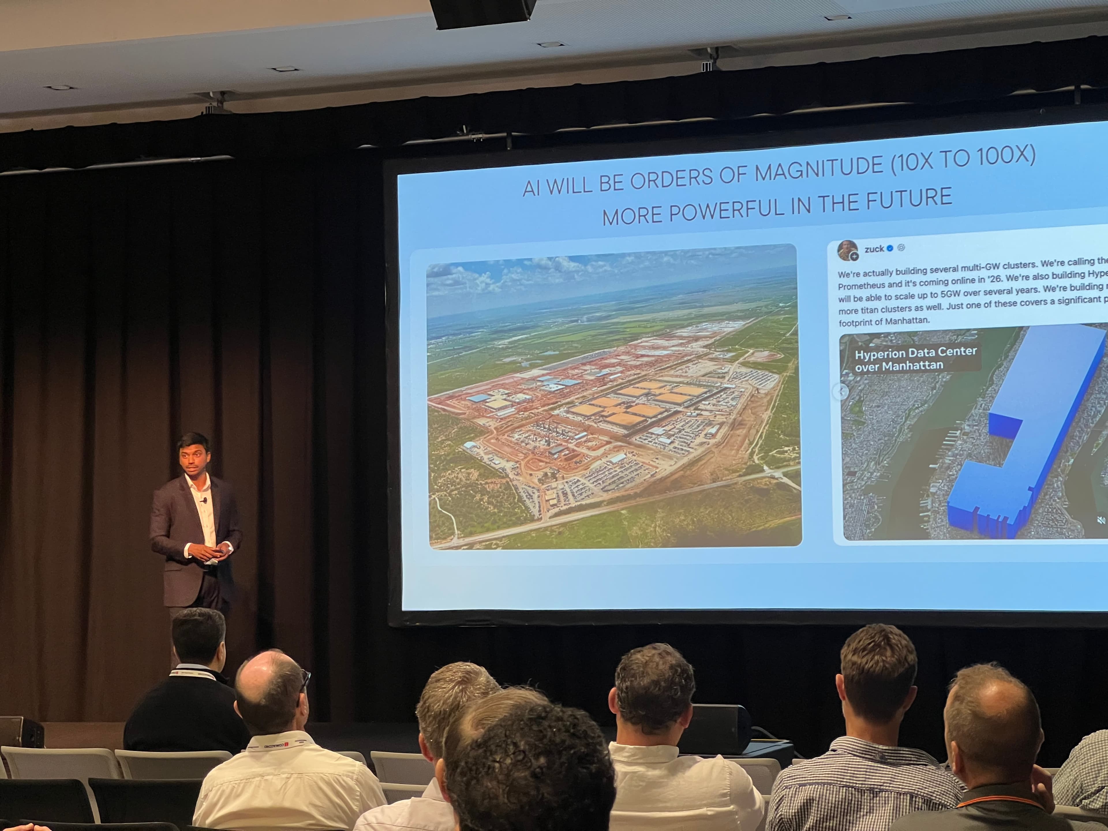 Tam presenting to an audience at an industry event