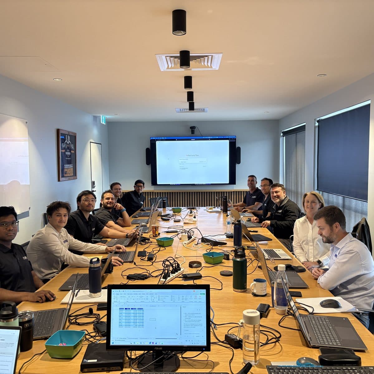 Anora Foundations team working hands-on during the Enable AI Capability Sprint in Brisbane