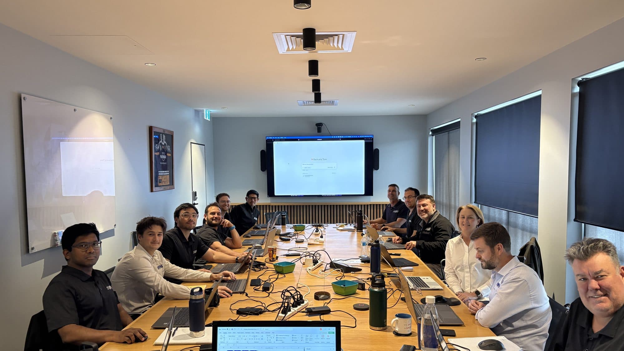 Anora Foundations team working hands-on during the Enable AI Capability Sprint in Brisbane