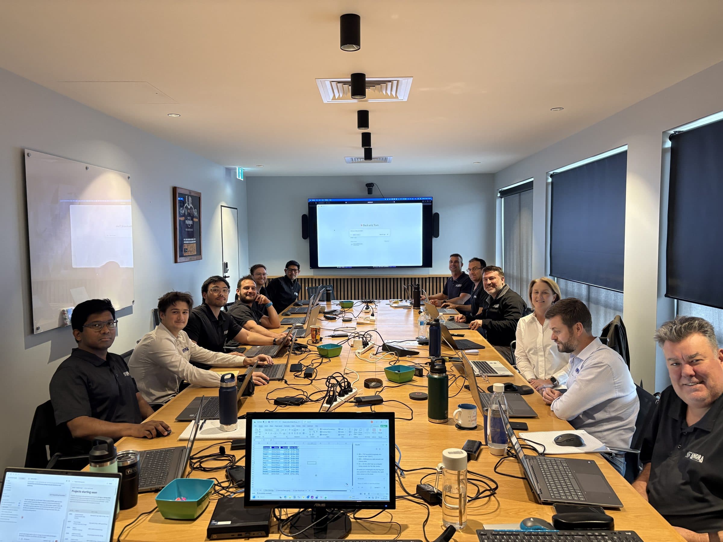 Anora Foundations team working hands-on during the Enable AI Capability Sprint in Brisbane